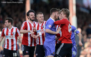 Wolves' James Henry confronts Brentford players after a foul on the winger