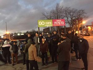 Some of the protesting taxi-drivers outside the Go Carz offices