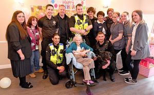 Lillian Hollinshead will celebrate her 102nd birthday at Dovedale Court Care Home, Wednesbury on Monday. She is pictured with staff members, and visiting police and firefighters who dropped in to wish her well before the weekend