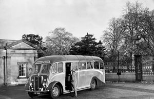 A Guy Motors bus pictured in 1956 - location not stated at the time but outside a park. It was speculated in the Express & Star in subsequent articles that it was West Park in Wolverhampton, but the location is clearly Himley Park as the building and gates have barely changed.