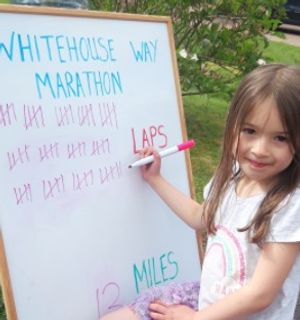 Freya Snape, aged five, marks off the laps. Photo: Mark Hinton