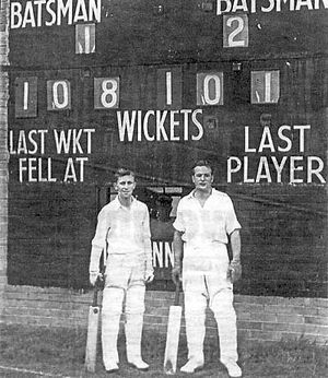 Colin Wright (LEFT) stands by his record scoreboard on September 12, 1953