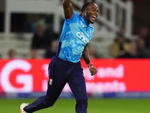 Jofra Archer celebrates a wicket with his arm in the air