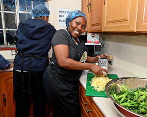 Rabi Zabadi helps to prepare the meals