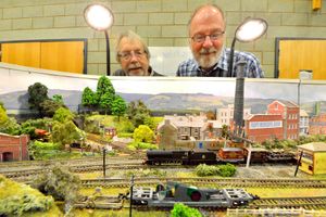 Supporting image for story: 'Defining the concept of "working class" is challenging' - Your Letters and model railway enthusiasts admiring their handiwork in a picture from our archives