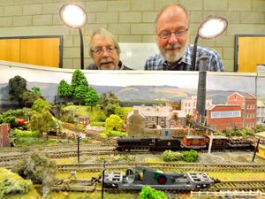 Supporting image for story: 'Defining the concept of "working class" is challenging' - Your Letters and model railway enthusiasts admiring their handiwork in a picture from our archives