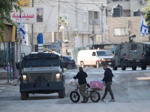 Israeli army vehicles are seen during a military operation in the West Bank city of Jenin