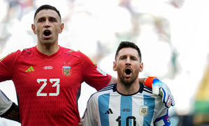 Argentina's Lionel Messi and Argentina's goalkeeper Emiliano Martinez sing the national anthem prior to the World Cup group C soccer match between Argentina and Saudi Arabia at the Lusail Stadium in Lusail, Qatar, Tuesday, Nov. 22, 2022. (AP Photo/Natacha Pisarenko).
