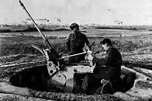 British soldiers take a look at the German guns