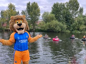 Blue the lion - one of the club's mascots - near the river for the event