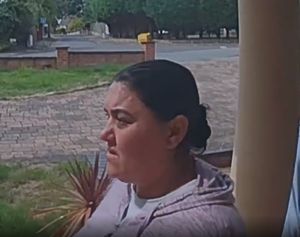 The other woman was seen ringing the bell several times before going around the side of the house. Photo: West Midlands Police