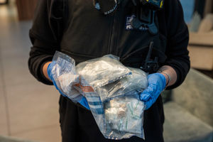Items seized after Metropolitan Police officers carry out a dawn raid in Canary Wharf, London, as they execute a warrant as part of an investigation into a County Lines drug gang. Photo: PA Wire