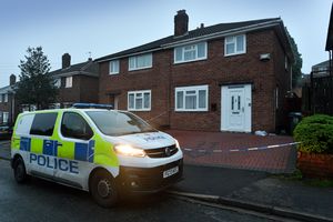 Police remain at the scene of a murder in Barncroft Road, Oldbury.