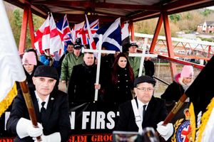 Leader and deputy leader Paul Golding and Jayda Fransen carried white crosses during the march