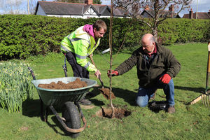 Supported intern James plants with head gardener Don.