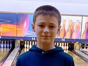 Leo Ross in a bowling alley