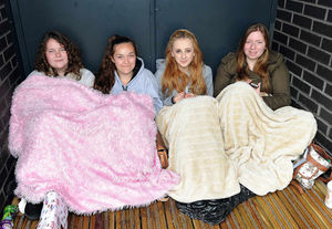 Laura Cunningham, Bethany Ambrose, Chloe Bythell and Jessica Cotterill wait to buy tickets