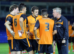 Kenny Jackett manager of Wolverhampton Wanderers speaks with Scott Golbourne, Sam Ricketts, Kevin McDonald and Danny Batth at the end of the match (AMA)