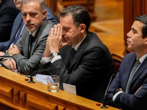 Portuguese Prime Minister Luis Montenegro, second right, gesturing in parliament