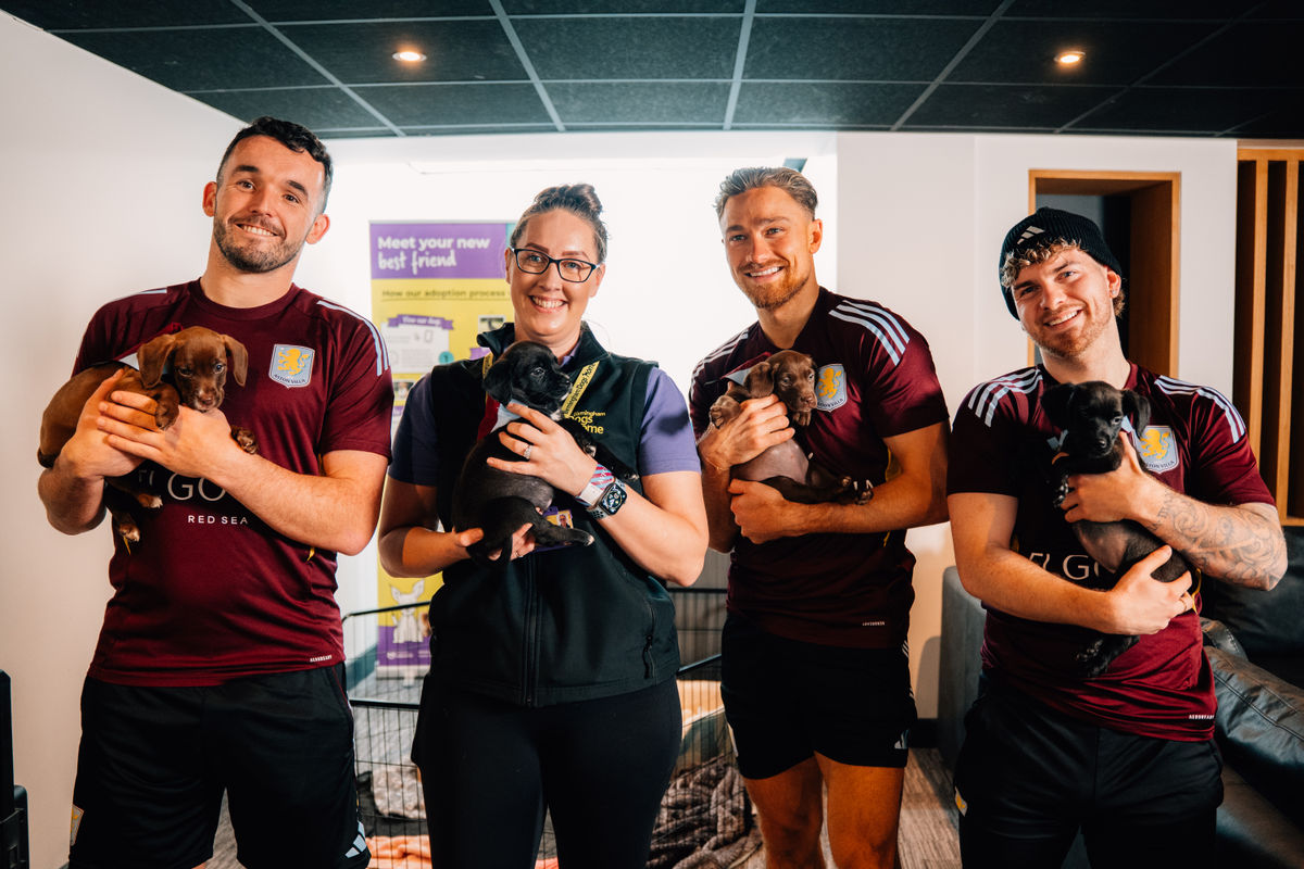 Aston Villa stars play with rescue pups during visit to dogs' home
