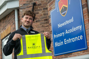 BM - SGB-56647 - Head of School Jack Kinsey accepting Barratt Homes' donation