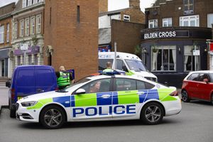 Police maintained a presence outside the pub in the town's Market Place. Picture: John Kennett