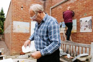 Volunteers Malcolm Kay and Richard Loat replacing lights