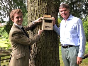 Supporting image for story: MP Philip Dunne puts up birdbox after talks on ‘vital role’ of conservation work