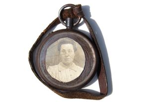 Locket carried by Sergeant Edward Kenny, containing a photograph of his wife Margaret, along with a lock of her hair. 