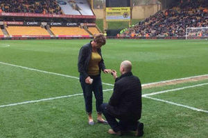 Les Roberts, 42 from Wellington, pops the question to Julie Shinton, 46, from Wednesfield, at the Molineux