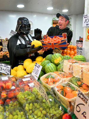 Jason Woods from Wood's Spuds and Buds gets a fright as he meets Darth Vader who will be present at Brierley Hill Indoor Market's Star Wars day on Saturday