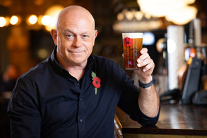 Ross Kemp holding a new limited-edition pint glass