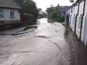Supporting image for story: WATCH: Road turned to river as village becomes latest rain victim