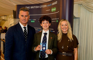 Presenter Tim Vincent (left) with British Youth Citizen Award recipient Walter Sulaman-Evans and Laurna Woods CEO at Tigerbond