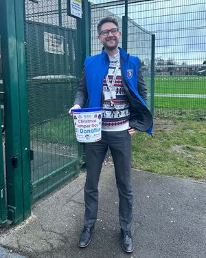 Dan Boden collecting donations for Christmas Jumper Day
