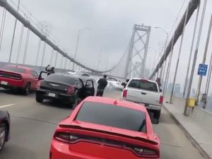 Supporting image for story: Sports car hooligans halt San Francisco Bay Bridge for reckless donut display