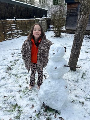 6-year-old Miley with Sergio the snowman in Wellington. Photo: Bethan Owens