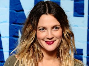 Supporting image for story: Drew Barrymore escorted backstage at New York event after fan moves towards her