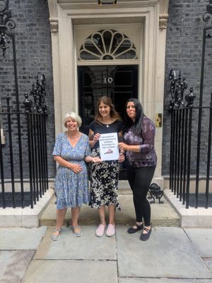 Cat Eccles MP, centre, joins animal campaigners to hand in their petition at Downing Street