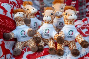 B&DWM - SGB-64837 - The Make Some Noise mascot, newly named Gandalf the Giraffe