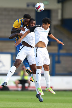 Chey Dunkley of Shrewsbury Town and Nathan Blissett of AFC Telford United (AMA)