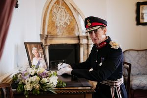 Shropshire's Lord Lieutenant Anna Turner signs a book of condolence at Shrewsbury Castle