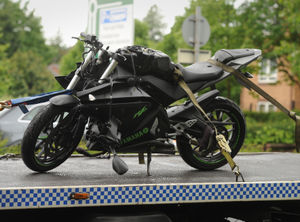  A motorcycle is taken away after being involved in a crash at Stafford Road, Wolverhampton..