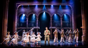 Che, centre stage, surrounded by other members of the cast