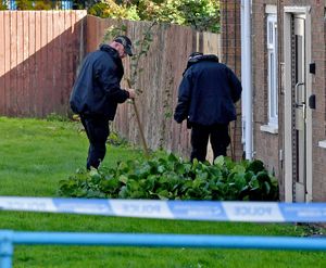 Police and scene of crime officers at Lilleshall Crescent, Wolverhampton, after a murder inquiry is launched after man is shot dead.
