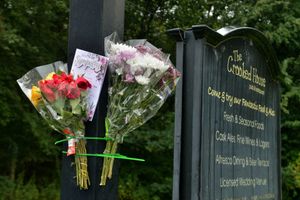 Flowers and a sympathy card left at the scene