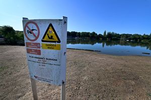 A warning sign can be seen at the Pool