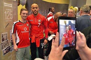 Adam Chambers poses with 14-year-old fan Liam Stewart.