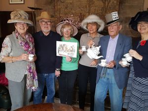 Members of LCSG committee get ready for the Mad Hatter's Tea Party and Coffee Morning on Friday 28 March.