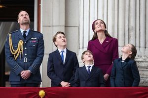 Prince William, Prince of Wales, Prince George of Wales, Prince Louis of Wales, Catherine, Princess of Wales and Princess Charlotte of Wales watch the Red Arrows flypast from Buckingham Palace.
